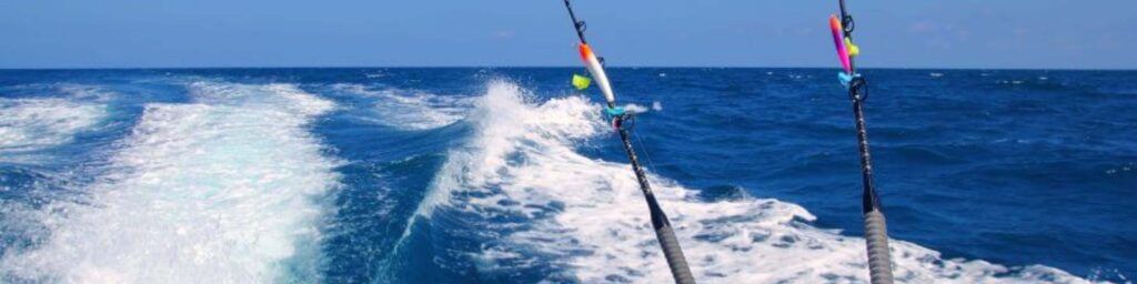 boat on water with fishing poles