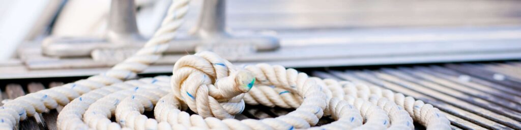 rope tied to cleat on dock