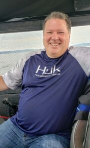 smiling man on boat