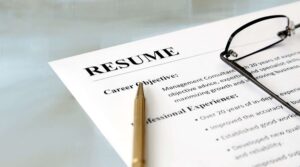 resume pencil glasses on desk