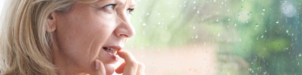 woman thinking looking out window