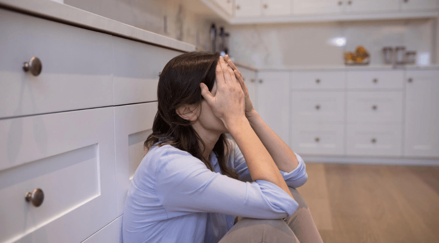 mom crying on kitchen floor