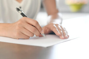 woman filling out worksheet