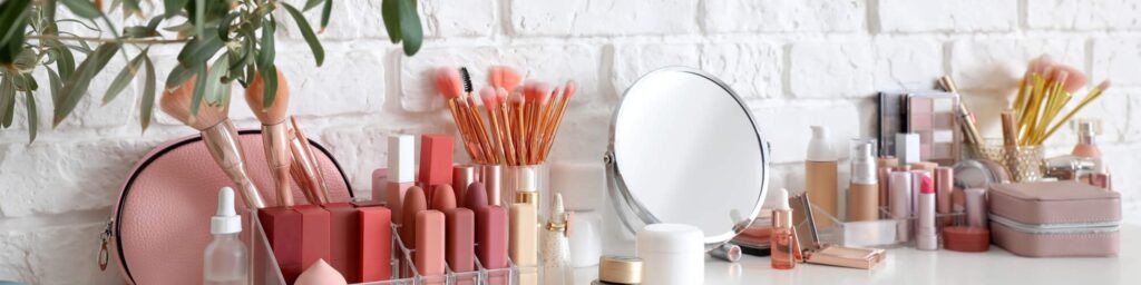 makeup and mirror on countertop