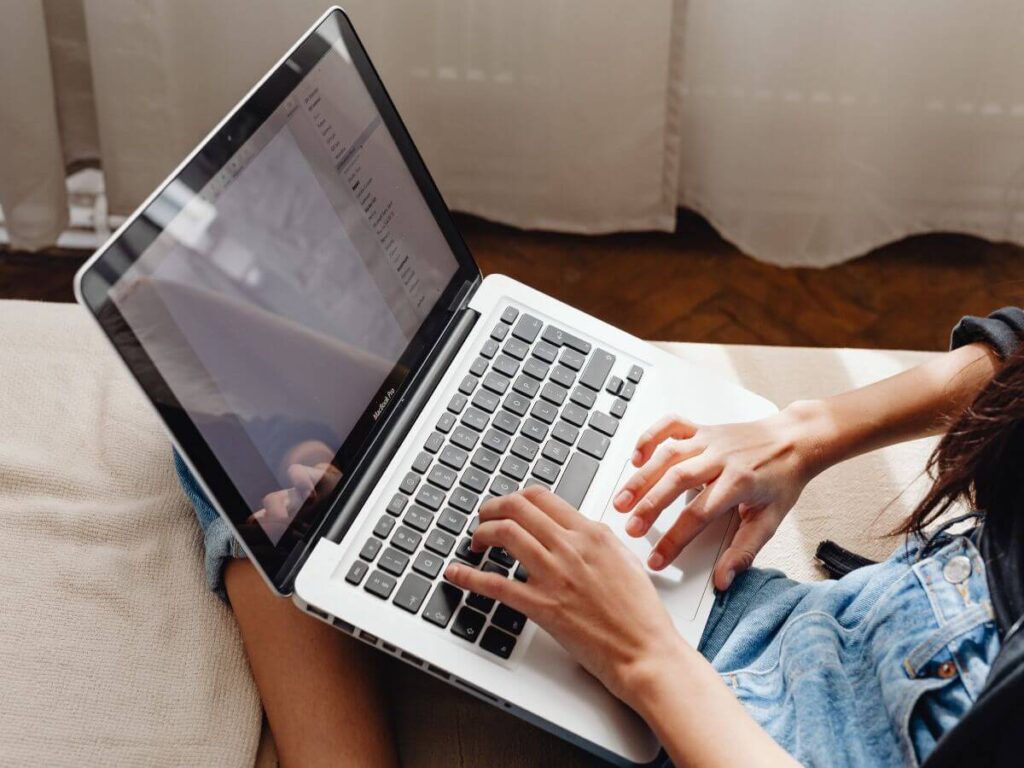 woman searching on laptop for ideas on what to do as empty nester